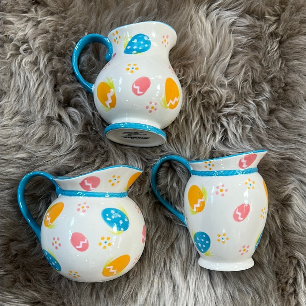 Temptations old world Egg Hunt set of three pitchers.